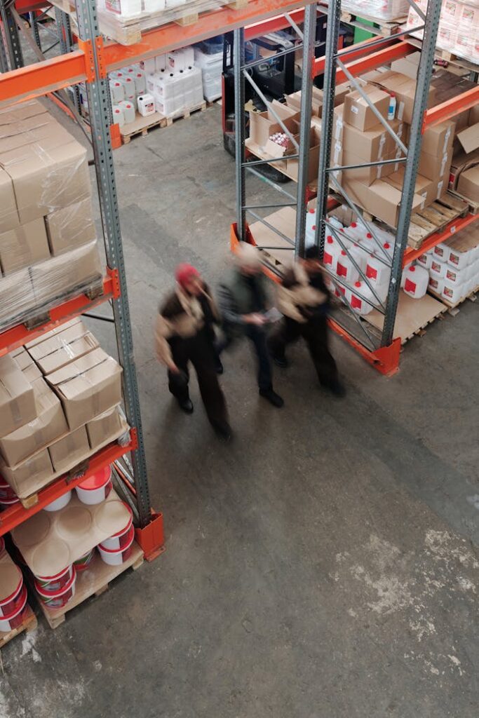Mastering the First Impression: Your intriguing post title goes here Blurred motion of workers managing inventory in a warehouse.